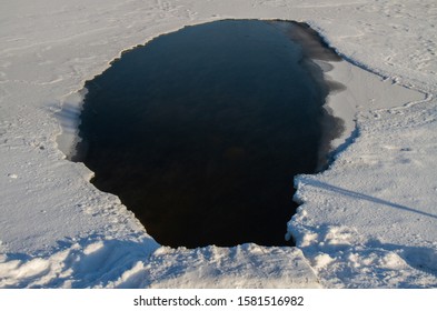 A Frozen Hole In The Ice.
Winter River.