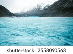 Frozen Hooker Lake ice with Hooker Glacier terminus in background -  Canterbury, New Zealand South Island near Mount Cook Aoraki - valley track hike, Landscape photography