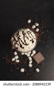 Frozen Hot Chocolate From Above With Chocolate Pieces And Marshmallows. 