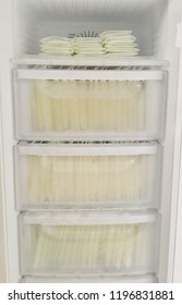 Frozen Human Female's Breast Milk Collected In Breastmilk Plastic Zip Lock Bags By Pumping Electric Machine That Storage In Breast Milk Freezer Refrigerator To Keep As Stock For Baby Breastfeeding