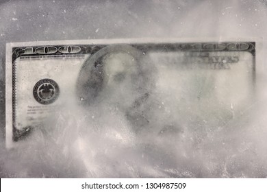 Frozen In Ice Bill Of The American Dollar. Currency, Foreign Currency Account, Freezing The Account.