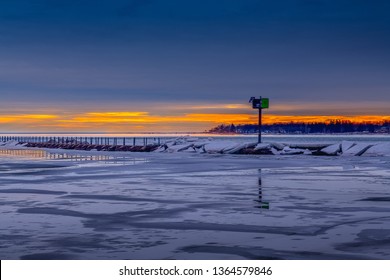 Frozen Or Ice Cover Winter Landscape In Buffalo New York Outer Harbor Sunset At The Blue Hour.