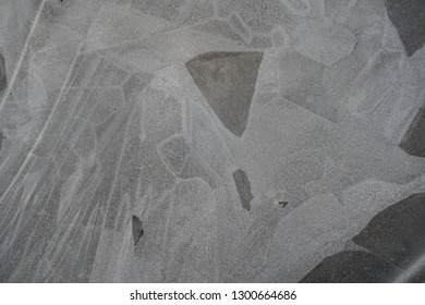 Frozen ice surface with beautiful pattern. Ice surfaces in the forest with abstract pattern