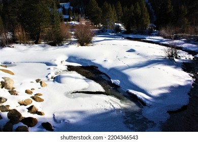 Frozen Icy River With A Snow Bank