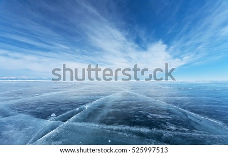 Frozen Lake Baikal. Beautiful stratus clouds over the ice surface on a frosty day. Natural background