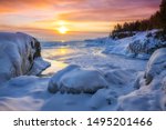 Frozen Lake Superior  sunrise at Presque Isle Park, Winter in Marquette, Michigan. 