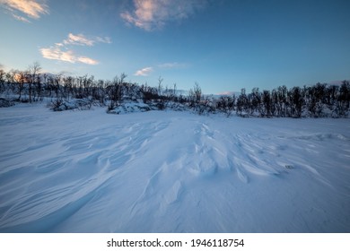 The Frozen Lake Torneträsk In Swedish Lapland. Beautiful Ice Forms Create An Amazing Sight.