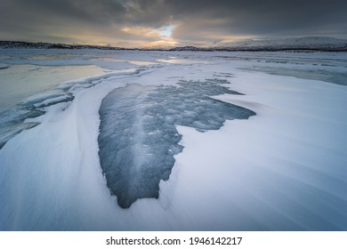 The Frozen Lake Torneträsk In Swedish Lapland. Beautiful Ice Forms Create An Amazing Sight.
