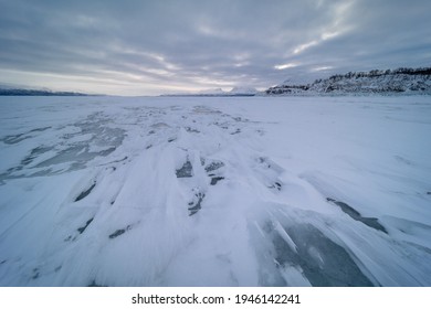 The Frozen Lake Torneträsk In Swedish Lapland. Beautiful Ice Forms Create An Amazing Sight.
