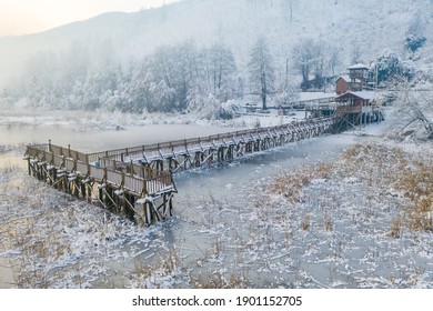 Frozen Lake And Wooden Pier Aerial Photo