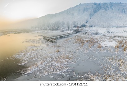 Frozen Lake And Wooden Pier Aerial Photo