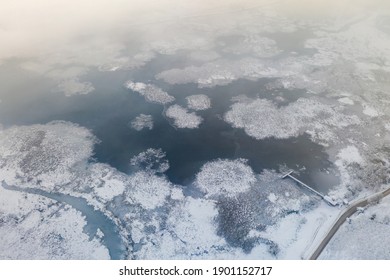 Frozen Lake And Wooden Pier Aerial Photo