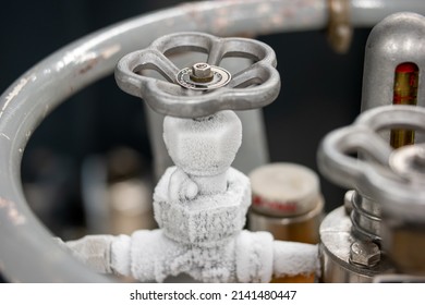 Frozen Liquid Nitrogen Storage Tank Transfer Valve. Close Up Shot, No People.