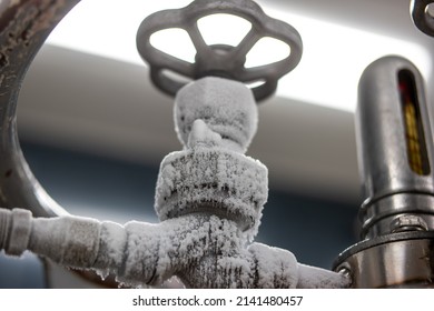 Frozen Liquid Nitrogen Storage Tank Transfer Valve. Close Up Shot, No People.