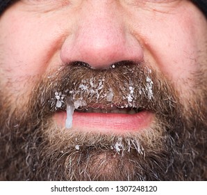 Frozen Man Face Close-up. Frozen Beard. Winter Concept.