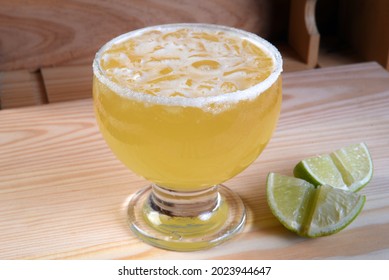 Frozen Margarita Mixed Drink With Lime Slice On Plain Background Close Up

