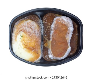 A Frozen Mashed Potatoes And Meat Loaf TV Dinner In Tray.