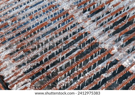 frozen metal grating Close-up. Abstract background.