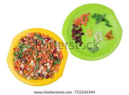 Frozen "Mexican" vegetable mix. On one plate - the contents of the plastic mass production package. On the other - sorting by parts. Isolated on white top view studio shot