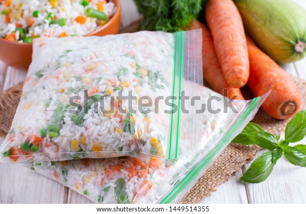 Frozen mixed vegetables in freezer bag. Frozen\
vegetable mix with rice