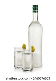 Frozen Ouzo Bottle And Two Glasses With Green Olives, Close Up