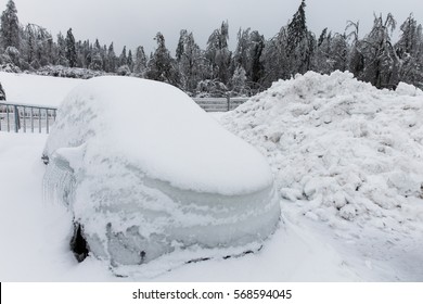 Frozen Parked Car, Covered In A Lot Of Snow After Snow Blizzard In A Parking Spot. Severe Weather, Wintertime And Traffic Concept. 