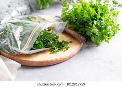 Frozen Parsley In A Plastic Bag. Frozen Vegetables. Concept Of Healthy Eating.