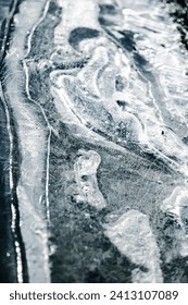 Frozen pattern on water. Frozen puddle