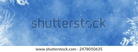Frozen pattern on winter window. Blue ice winter background, texture blue wallpaper. Banner of fozen blue background. 