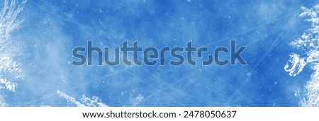 Frozen pattern on winter window. Blue ice winter background, texture blue wallpaper. Banner of fozen blue background. 