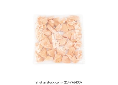 Frozen Pieces Of Chicken Fillet On An Isolated White Background.Chicken Fresh Meat In A Transparent Bag.