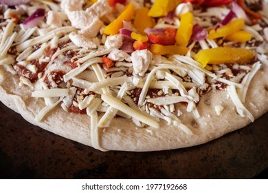 Frozen Pizza With Chicken Pieces, Red And Yellow Peppers Ready To Be Cooked. Fast Food Concept. Retail Industry Product. Selective Focus, Close Up