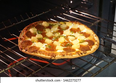 Frozen Pizza On Rack In Home Oven                            