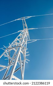 Frozen Power Line Pylons. Hoarfrost On High Voltage Cables And Pylons.