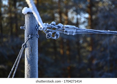 Frozen Power Line In Swedish Winter Season.