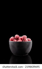 Frozen Raspberries In Dark Bowl On Black Background. Frozen Fruits - Clever Storage Food. Selective Focus, Copy Space. Vertical Orientation.