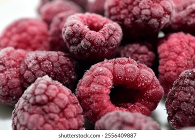 Frozen raspberry close-up on a white background. - Powered by Shutterstock