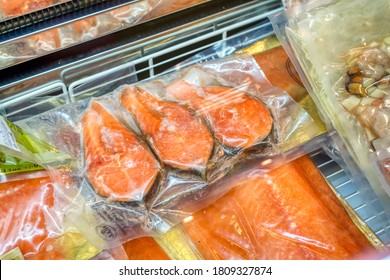 Frozen Red Fish Lies In A Shop Window. Frozen Seafood In Vacuum Packaging.