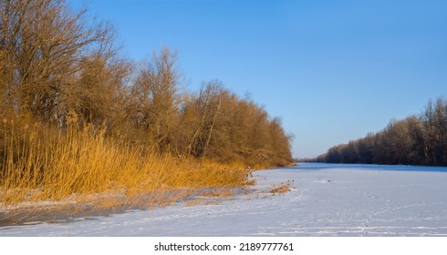 Frozen River Covered By Snow, Winter Outdoor Scene