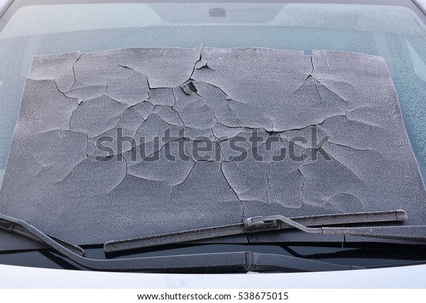 Frozen rubber Mat on\
the car windshield.