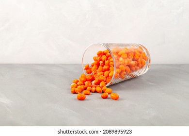 Frozen Sea Buckthorn Berries On Grey Table. Selective Focus, Copy Space. Frost. Clever Storage Organic Foods To Support Immune System.