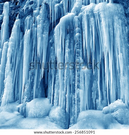 frozen small mountain waterfall close up