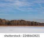 Frozen and snow-covered Echo Ponds in Roztocze National Park.