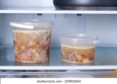 Frozen soup in the refrigerator
