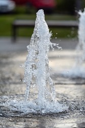  Frozen Spray, Visible Drops Of Water In The Air. Fountain From Underground