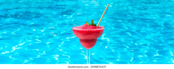 Frozen Strawberry Daiquiri at poolside on sunny summer day. Concept of cool refreshing beverages - Powered by Shutterstock