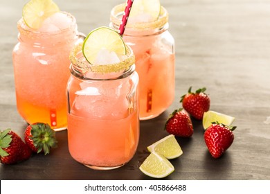 Frozen Strawberry Margarita Cocktail In Drinking Mason Jar.