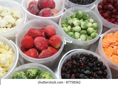 Frozen Summer Fruits And Healthy Vegetables In Plastic Containers