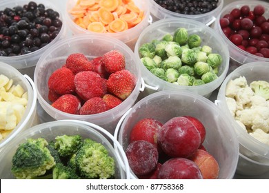 Frozen Summer Fruits And Healthy Vegetables In Plastic Containers