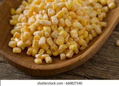 Frozen Sweet Corn On Woode Surface